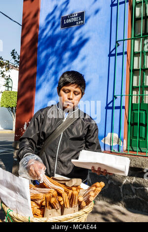 Mexico City,Mexican,Hispanic,Coyoacan,Del Carmen,Museo Frida Kahlo,museum,Caza Azul,Blue House,exterior outside,boy boys,male kid kids child children, Stock Photo