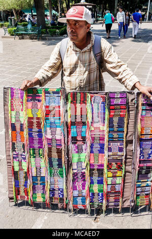 Mexico City,Mexican,Hispanic Latin Latino ethnic,Coyoacan,Del Carmen,Jardin Centenario,plaza,adult adults man men male,street vendor vendors Stock Photo