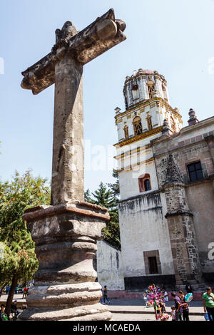 Mexico City,Mexican,Hispanic,Coyoacan,Del Carmen,Parroquia San Juan Bautista,Saint John the Baptist Catholic Church,convent,outside,plaza,cross,bell t Stock Photo