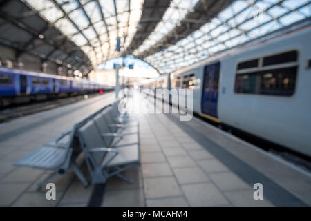 Blurred image bokeh of Trains at the platform inside Liverpool Lime Street Train Station. Stock Photo