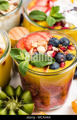 Ripe fruits and superfoods jars, layered food. Stock Photo