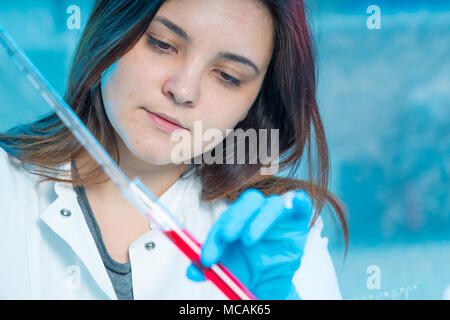 Scientists mixing chemicals. Chemical experiment Stock Photo