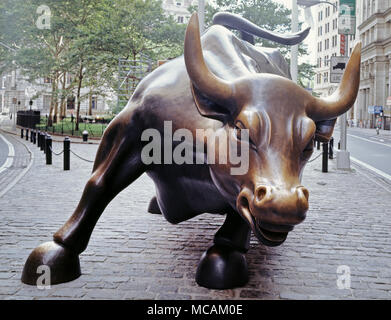 Charging Bull, which is sometimes referred to as the Wall Street Bull or the Bowling Green Bull, is a 3,200-kilogram (7,100?lb) bronze sculpture by Arturo Di Modica that stands in Bowling Green Park near Wall Street in Manhattan, New York City. Standing 11 feet (3.4?m) tall and measuring 16 feet (4.9?m) long. the oversize sculpture depicts a bull, the symbol of aggressive financial optimism and prosperity, leaning back on its haunches and with its head lowered as if ready to charge. The sculpture is both a popular tourist destination which draws thousands of people a day, as well as one of the Stock Photo