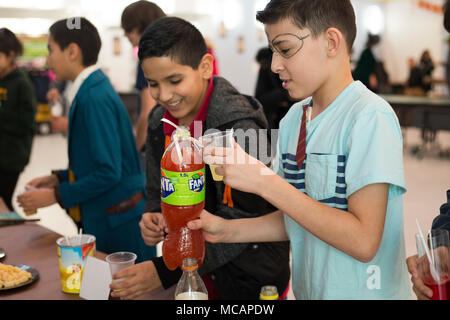 SHAPE, Belgium (Feb. 01, 2018) Justin Lopez, Supreme Headquarters Allied Powers Europe (SHAPE) American Middle School student from Tucson, Arizona, and Jesus Moreno from Brownsville, Texas mix up potions at the fourth annual Harry Potter Palooza. This event brings students and teachers with similar interests together for Harry Potter themed food, drinks, and games. (U.S. Air Force photo by Broadcast Journalist Airman 1st Class Hannah Anderson/Released) Stock Photo