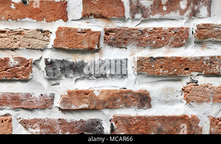 Close up new interior or exterior red brick wall with mortar and grouting Stock Photo
