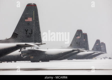 Snow-covered C-130J Super Hercules' sit on the flightline at Yokota Air Base, Japan, Feb. 2, 2018. The latest wintery blast came less than two weeks after Yokota was hit by its heaviest falls in four years when 12.5 inches of snow fell on base between Jan. 22 and 23. (U.S. Air Force photo by Yasuo Osakabe) Stock Photo