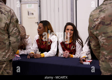 Washington Redskins Cheerleaders sign autographs for U.S. Army Soldiers for the 52nd Super Bowl Celebration during the Armed Forces Entertainment’s 58th Military Appreciation Tour at the 7th Army Training Command's Hohenfels Training Area, Hohenfels, Germany, Feb. 5, 2018. (U.S. Army photo by Staff Sgt. David Overson) Stock Photo