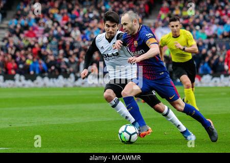 Barcelona, Spain. 14th Apr, 2018. Barcelona's Andres Iniesta (R) competes during a Spanish league soccer match between Barcelona and Valencia in Barcelona, Spain, on April 14, 2018. Barcelona won 2-1. Credit: Joan Gosa/Xinhua/Alamy Live News Stock Photo