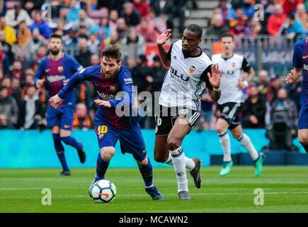 Barcelona, Spain. 14th Apr, 2018. Barcelona's Lionel Messi (L Front) competes during a Spanish league soccer match between Barcelona and Valencia in Barcelona, Spain, on April 14, 2018. Barcelona won 2-1. Credit: Joan Gosa/Xinhua/Alamy Live News Stock Photo