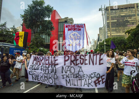 April 15, 2018 - SÃ£O Paulo, SÃ£o Paulo, Brazil - SAO PAULO SP, SP 15/04/2018 BRAZIL-FRANCO-CRIME-ONE MONTH-DEMO: People gather in Paulista Avenue, SÃ£o Paulo, Brazil during a demonstration marking one month of activist Marielle Franco's murder on April 15, 2018. The murder of Franco, a black Brazilian activist who fought her way out of the slums to become a popular councilor, made headlines around the world. The outspoken 38-year-old, who was a critic of police brutality, an advocate for minorities and the posterchild of a new type of politics, was shot dead on March 14 in an assassination-st Stock Photo