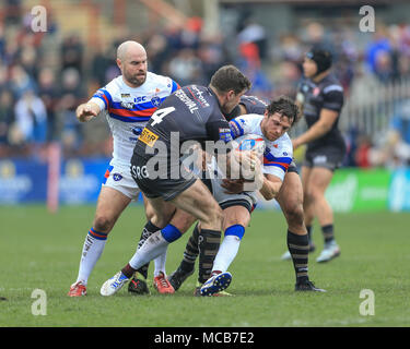 Mark Percival of St. Helens is tackled by Julian Bousquet of Catalan ...