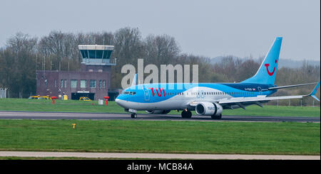 Stansted Airport, Essex, 15th April 2018  Aircraft movements at a foggy Stansted Airport in Essex, UK, G-fdzr TUI Fly Boeing 737-8k5 Credit: Ian Davidson/Alamy Live News Stock Photo