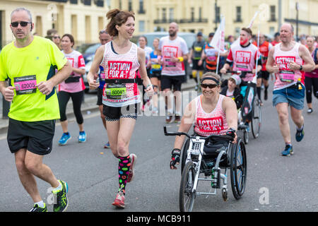 Brighton, Sussex, UK; 15th April 2018; Group of Runners Including One in Wheelchair Participating in Brighton Marathon. Credit: Ian Stewart/Alamy Live News Stock Photo