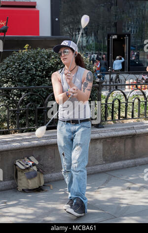 https://l450v.alamy.com/450v/mcba61/an-attractive-young-lady-performance-artists-performing-poi-the-swinging-of-tethered-balls-in-rhythmic-patters-in-union-square-park-in-new-york-mcba61.jpg