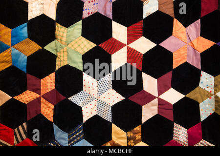Geometric shapes and details on colorful fabric quilt blanket Stock Photo