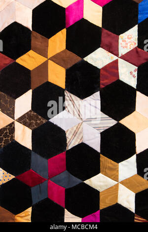 Geometric shapes and details on colorful fabric quilt blanket Stock Photo