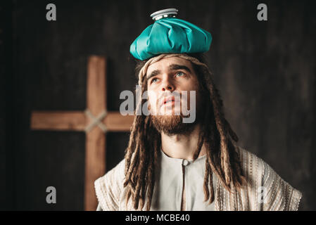 Jesus Christ with a heating pad on his head Stock Photo