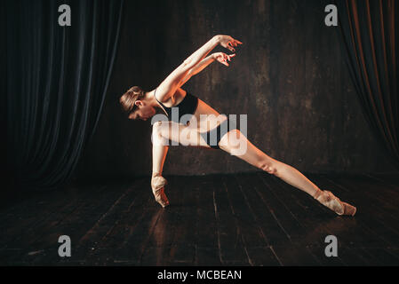 Classical ballet dancer in black practice training Stock Photo