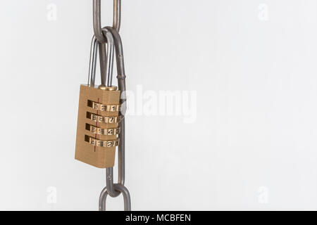 Macro-photo of small combination padlock with metal chain links. Metaphor for Blochain / Bitcoin blockchain. China Bitcoin conference metaphor. Stock Photo