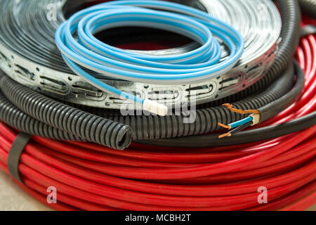 Heating floor system wires and cables. Renovation and construction concept. Comfort house. Stock Photo