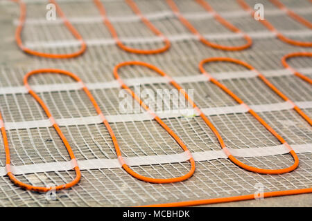 Heating cable for warm floor close-up detail. Renovation works. Stock Photo