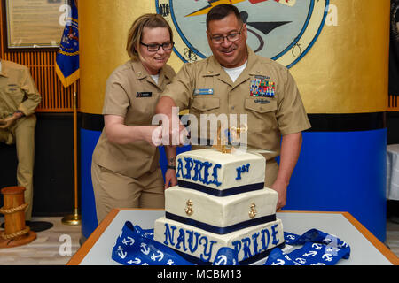 Fla. (March 30, 2018) Chief Information Systems Technician Geneva Mclean (left) and Master Chief Cryptologic Technician (Maintenance) Neil Watson cut the first slice of cake during an anniversary celebration for the rank of chief petty officer onboard Naval Air Station Pensacola Corry Station. April 1, 2018 marks the 125th birthday of the Navy’s Chiefs Mess. Stock Photo