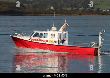 The Firth of Clyde-based Coegfran II, used in various roles such as a dive boat, fishing boat, or for sight-seeing tours, passes East India Harbour. Stock Photo