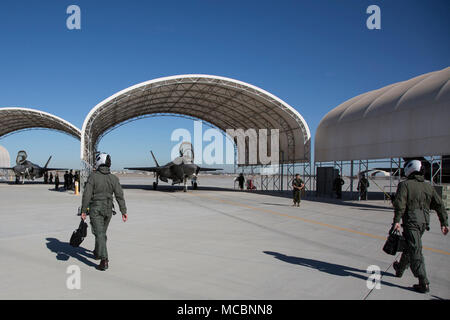 The Commanding Officer of Marine Fighter Attack Squadron 122 (VMFA-122), Lt. Col. John P. Price, and Maintenance Officer of VMFA-122, Maj. Christopher J. Kelly, prepare for VMFA-122's first flight operations in an F-35B Lightning II on Marine Corps Air Station (MCAS) Yuma, Ariz., March 29, 2018. VMFA-122 is conducting the flight operations for the first time as an F-35 squadron. Stock Photo