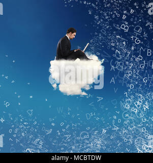 Businessman connected with his laptop over a cloud. concept of social network and internet addiction Stock Photo
