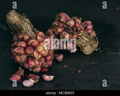 Premium Photo  Shallots or red onion purple shallots on wooden background  fresh shallot for medicinal products or herbs and spices thai food made  from this raw shallot