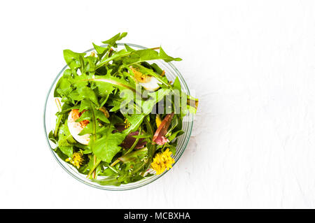 Fresh dandelion salad in a bowl top view Stock Photo
