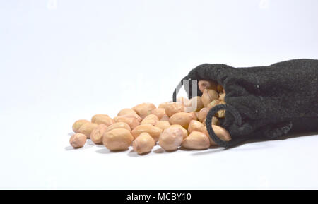 Peanuts in burlap bag isolated on white background Stock Photo