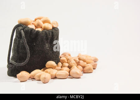 Peanuts in burlap bag isolated on white background Stock Photo