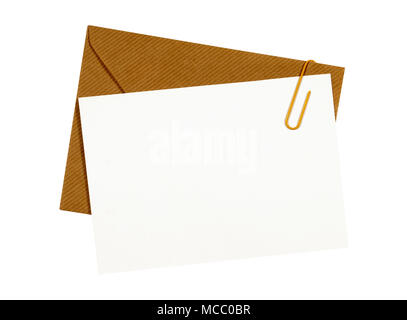 Brown manila envelope, blank letter or message card, paper clip, copy space Stock Photo