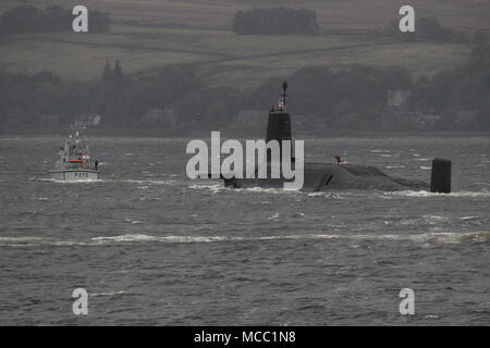 HMS Victorious (S29), a Vanguard-class submarine operated by the Royal Navy, on an inbound journey to the Faslane naval base, with HMS Raider (P275). Stock Photo