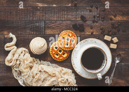 Coffee and cookies, food background. Table top view, toned image Stock Photo