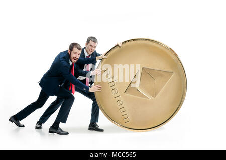 Two business men holding business icon Stock Photo