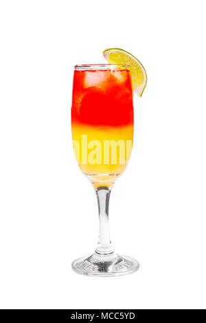 A multi-colored, two-layered, red and yellow opaque cocktail, in a high glass with ice cubes with the taste of grapefruit, berries, pineapple, orange  Stock Photo