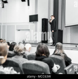 speaker speaks at a business conference in front of entrepreneurs and journalists Stock Photo