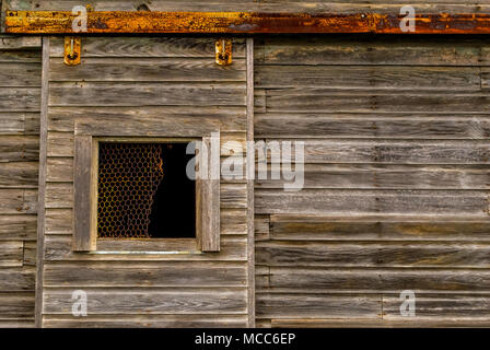 sliding barn door on rollers and a rail. Stock Photo