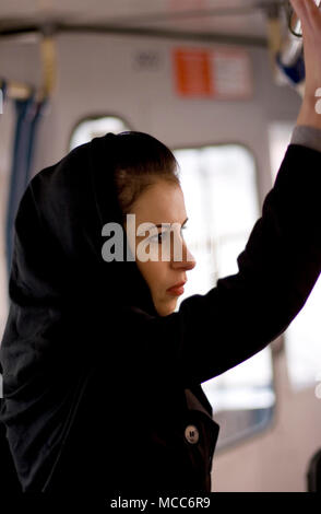 portrait of unhappy woman in a bus Stock Photo