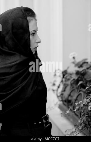 monochrome portrait of inconsolable widow Stock Photo