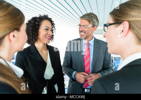 Co-workers having a conversation at the office Stock Photo