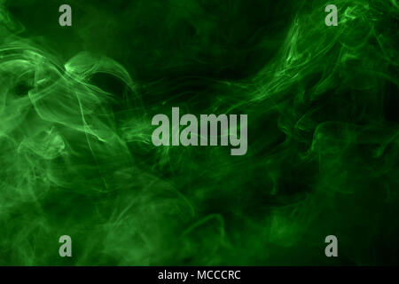 Poisonous green smoke close up on black. Texture and background Stock Photo