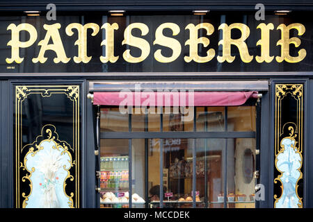 A French Patisserie shop window in the town of Dinan, Brittany, France