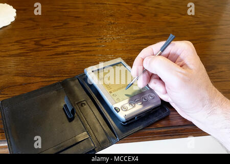Using a PDA (Handspring Visor Stock Photo - Alamy