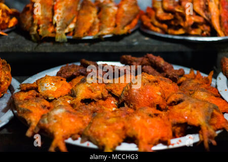 bunch of deep oil fried pomfret fish for sale Stock Photo