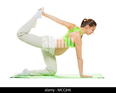 Pregnant woman making exercise, isolated on white Stock Photo