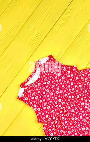 Toddler Girl Cute Printed Top Baby Girl Red Dress With A Pattern Of Small White Flowers Yellow Wooden Background Stock Photo Alamy