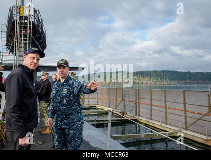 BANGOR, Wash. (Feb. 9, 2018) Cmdr. Jeffery Yackeren, commanding officer USS Alabama (SSBN 731) gives a tour to Deputy Secretary of Defense Patrick M. Shanahan (left). Shanahan also visited Submarine Development Squadron (DEVRON) 5, and Strategic Weapons Facility Pacific (SWFPAC) at Naval Base Kitsap-Bangor. Alabama is one of eight ballistic-missile submarines stationed at the base, providing the most survivable leg of the strategic deterrence triad for the United States. (U.S. Navy photo by Mass Communication Specialist 2nd Class Nancy C. diBenedetto/Released) Stock Photo